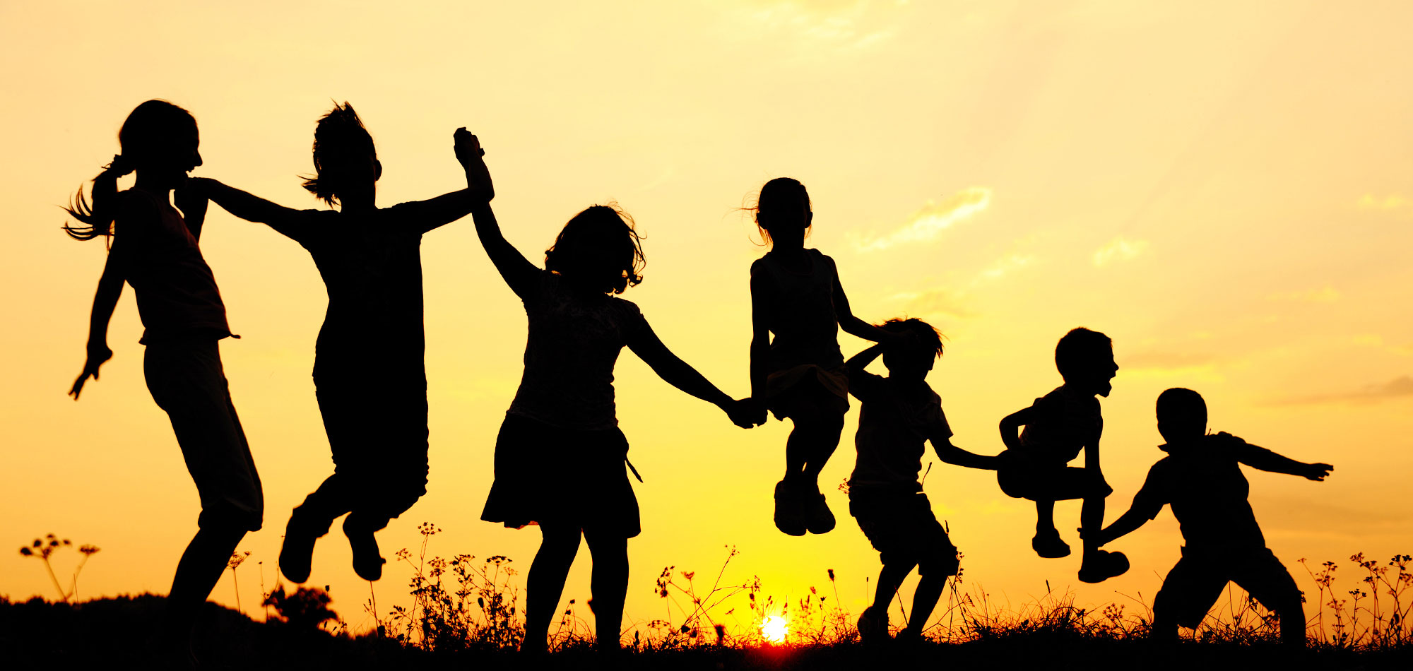 Children Jumping in Nature